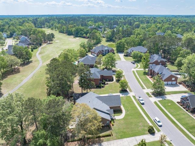 drone / aerial view with a view of trees and a residential view