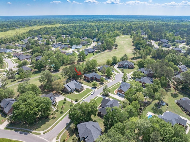 bird's eye view featuring a residential view and a forest view