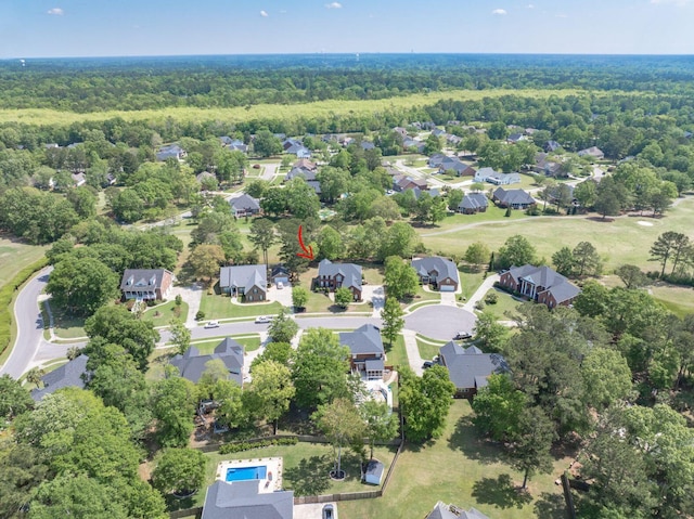 aerial view with a residential view and a view of trees