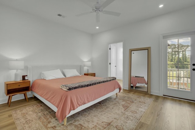 bedroom with ceiling fan, access to outside, and light hardwood / wood-style floors