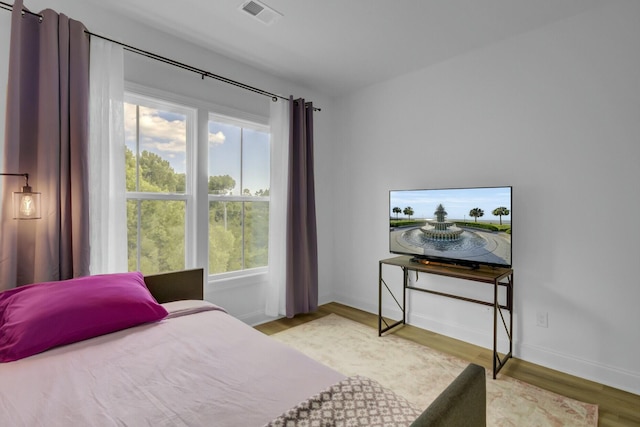 bedroom with light hardwood / wood-style flooring