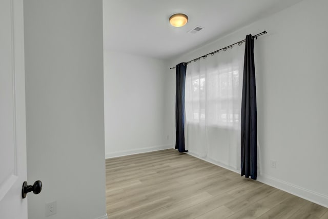 empty room featuring light hardwood / wood-style floors