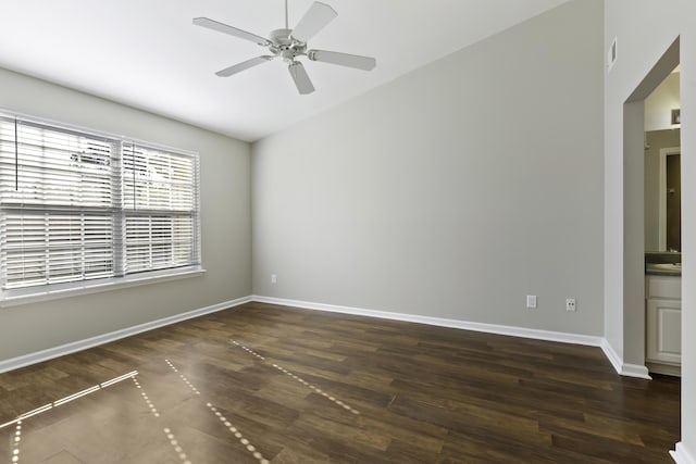 spare room with ceiling fan and dark hardwood / wood-style flooring