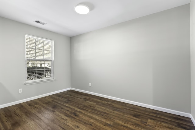 unfurnished room featuring dark hardwood / wood-style floors