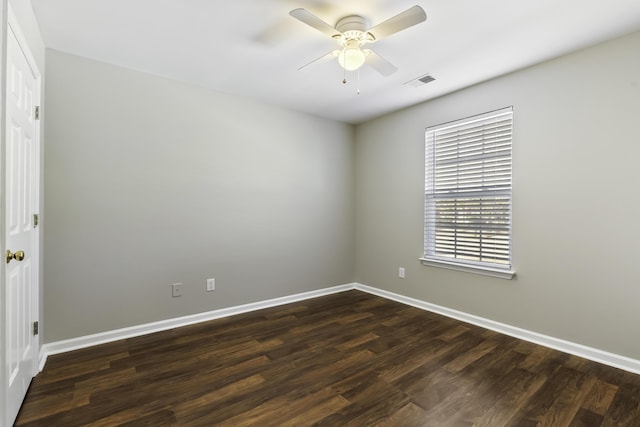 unfurnished room with ceiling fan and dark hardwood / wood-style floors