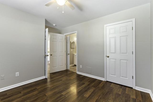 unfurnished bedroom with ceiling fan and dark hardwood / wood-style flooring