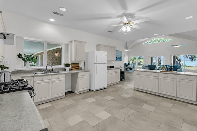 1085 Harts Bluff Rd, Wadmalaw Island, SC 29487 - kitchen with freestanding refrigerator, a ceiling fan, healthy amount of natural light, light countertops, and lofted ceiling