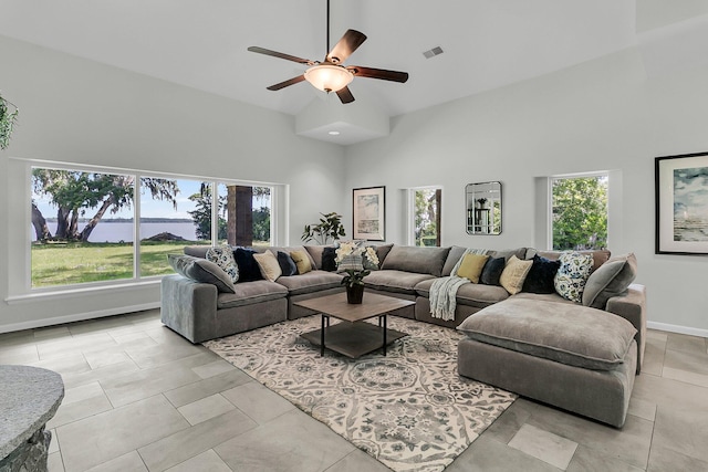 1085 Harts Bluff Rd, Wadmalaw Island, SC 29487 - living room featuring a towering ceiling, a ceiling fan, and light tile patterned floors