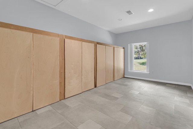 1085 Harts Bluff Rd, Wadmalaw Island, SC 29487 - unfurnished bedroom featuring recessed lighting, multiple closets, and light tile patterned floors
