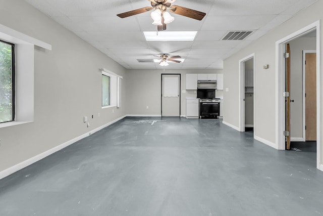 1085 Harts Bluff Rd, Wadmalaw Island, SC 29487 - unfurnished living room featuring finished concrete flooring, a ceiling fan, and a drop ceiling