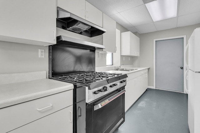 1085 Harts Bluff Rd, Wadmalaw Island, SC 29487 - kitchen featuring stainless steel gas range oven, ventilation hood, white cabinetry, light countertops, and a paneled ceiling