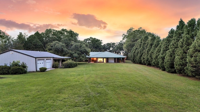 1085 Harts Bluff Rd, Wadmalaw Island, SC 29487 - view of grassy yard featuring an attached garage