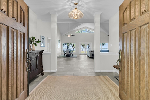 1085 Harts Bluff Rd, Wadmalaw Island, SC 29487 - foyer entrance with a ceiling fan, a chandelier, vaulted ceiling, and light tile patterned floors