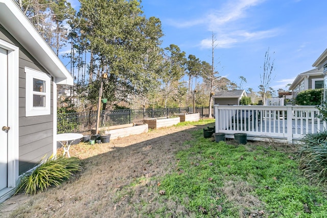 view of yard with fence and a vegetable garden