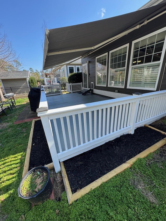 view of swimming pool featuring a yard and a deck