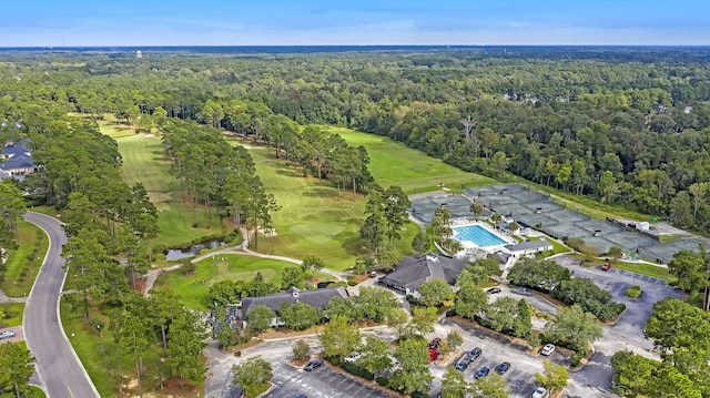 birds eye view of property featuring a forest view, a water view, and golf course view