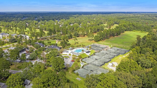 birds eye view of property featuring a forest view