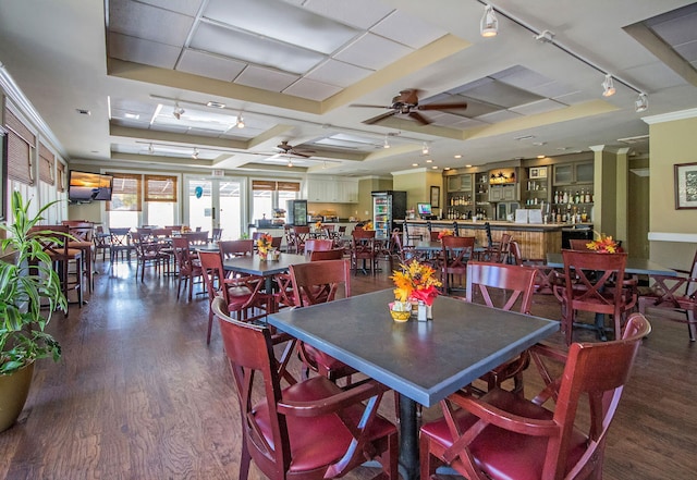 dining room featuring track lighting, ceiling fan, and dark wood-style floors