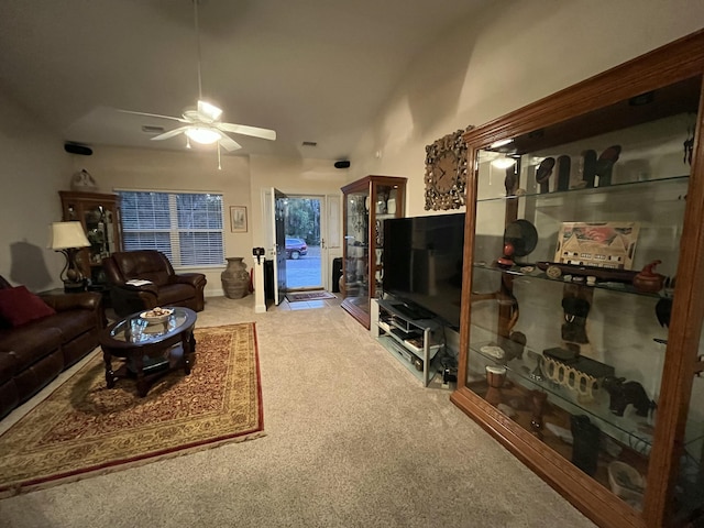 carpeted living room with ceiling fan