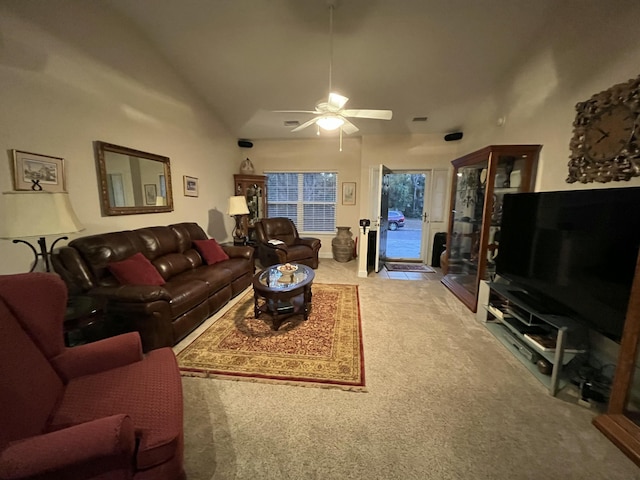 carpeted living room featuring ceiling fan and lofted ceiling