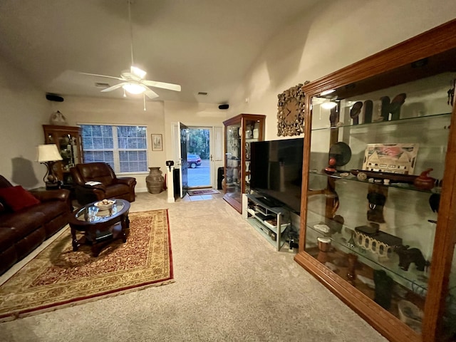 carpeted living room with ceiling fan