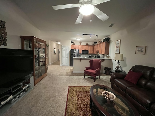 living room featuring light carpet and ceiling fan