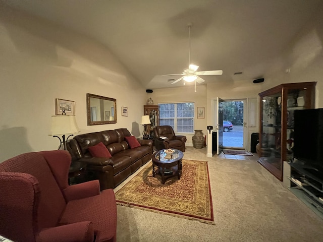 carpeted living room featuring ceiling fan and vaulted ceiling