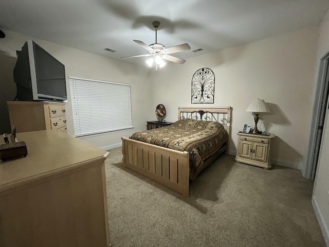 bedroom with ceiling fan and carpet floors