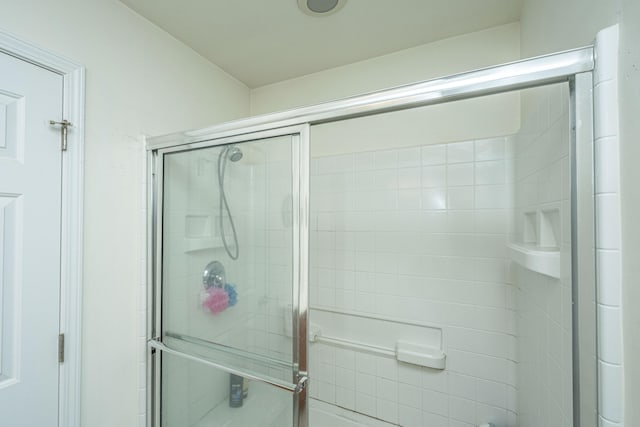 bathroom featuring walk in shower