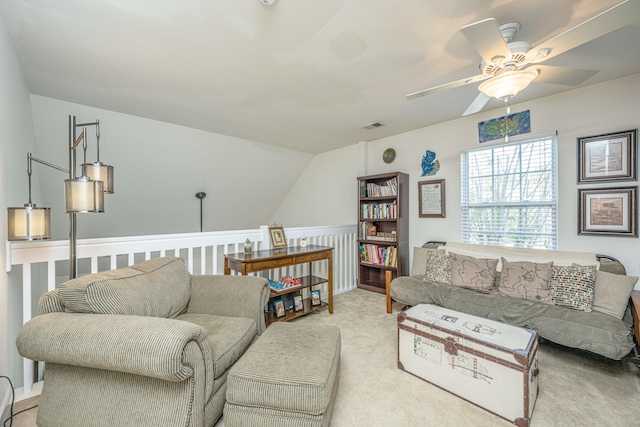 carpeted living room with lofted ceiling and ceiling fan