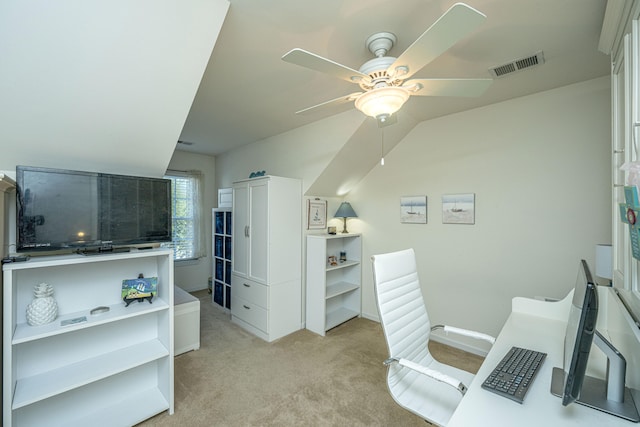 interior space with ceiling fan and light carpet