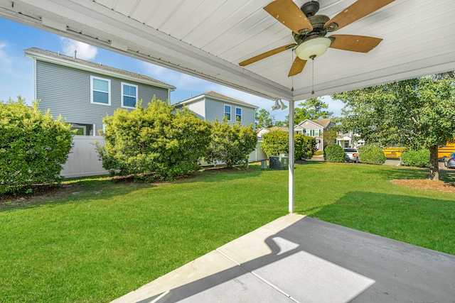 view of yard featuring ceiling fan and a patio area