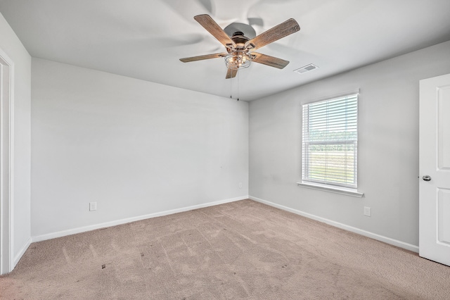 unfurnished room with ceiling fan and light colored carpet