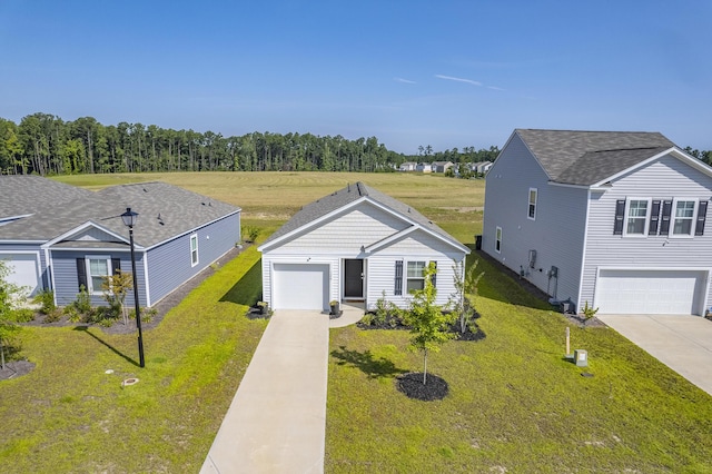 view of front facade featuring a front yard and a garage