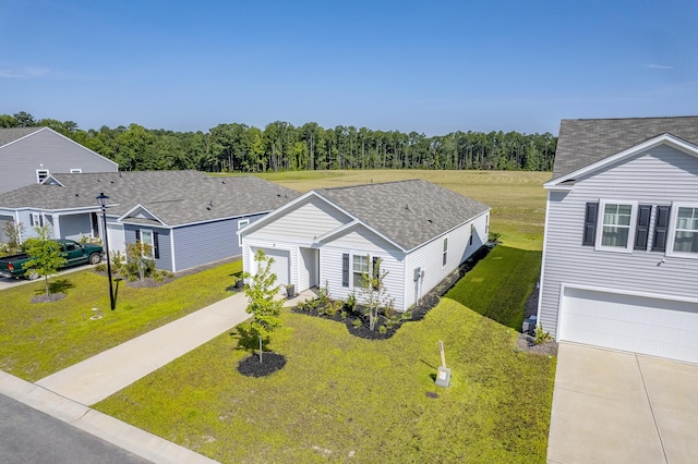 view of front of property featuring a garage and a front lawn