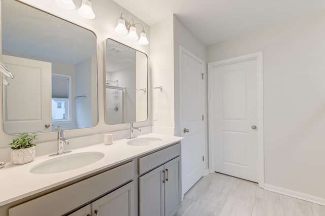 full bath with walk in shower, a sink, and double vanity