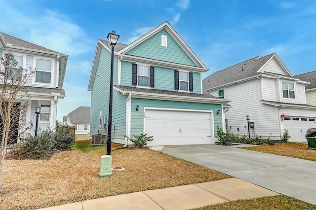 view of front facade featuring a garage, cooling unit, driveway, and a front lawn