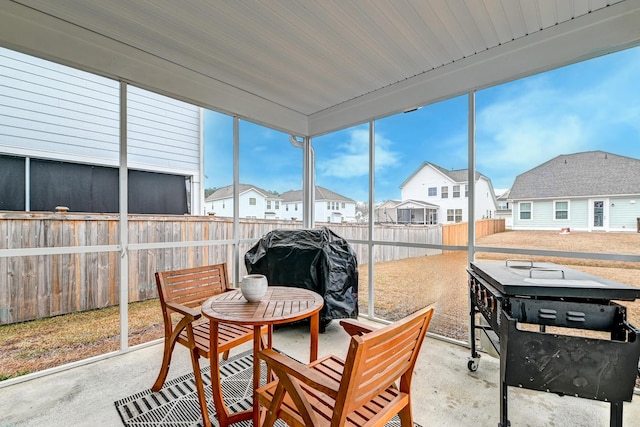 sunroom featuring a residential view