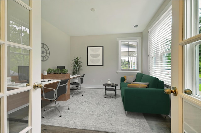 office featuring french doors and hardwood / wood-style flooring