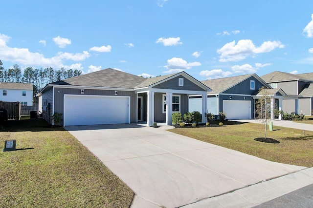 ranch-style home featuring a front yard and a garage