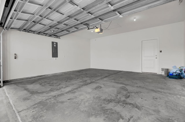 garage with a garage door opener and electric panel