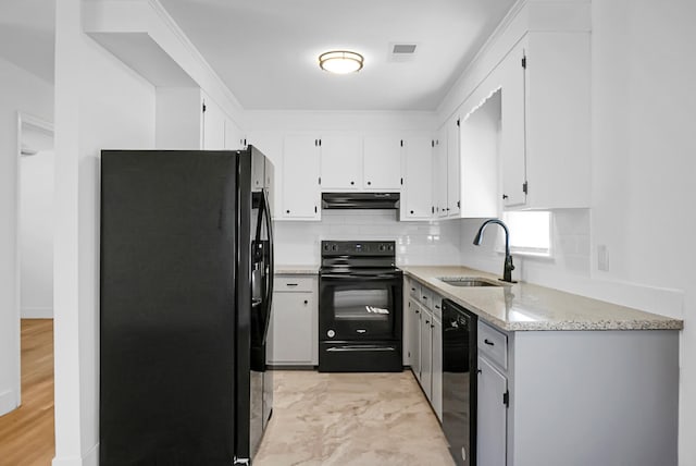 kitchen with decorative backsplash, light hardwood / wood-style flooring, sink, black appliances, and white cabinets