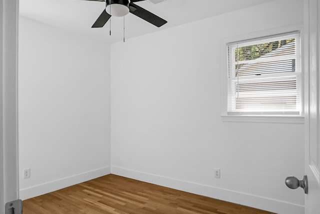 unfurnished room with ceiling fan and hardwood / wood-style floors