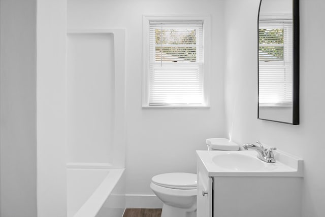 full bathroom with vanity, hardwood / wood-style flooring, toilet, and plenty of natural light