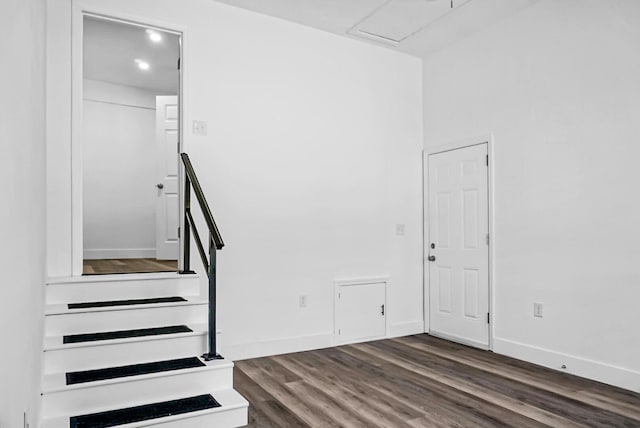 stairway featuring hardwood / wood-style flooring