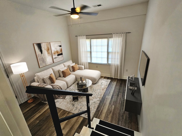 living room with wood-type flooring and ceiling fan