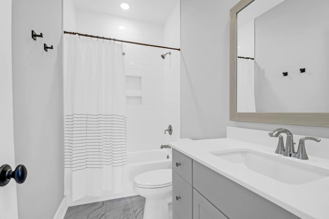 full bathroom with vanity, shower / bathtub combination with curtain, and toilet