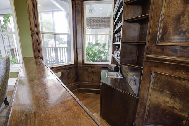 office with a sink, wood finished floors, and plenty of natural light