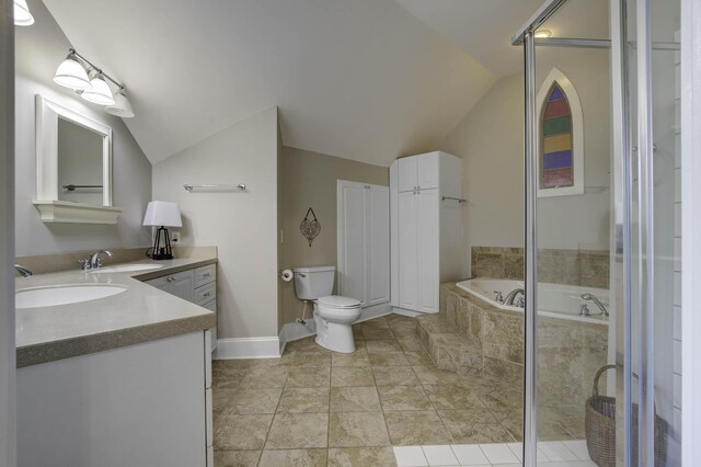 full bathroom featuring vaulted ceiling, toilet, vanity, and a bath