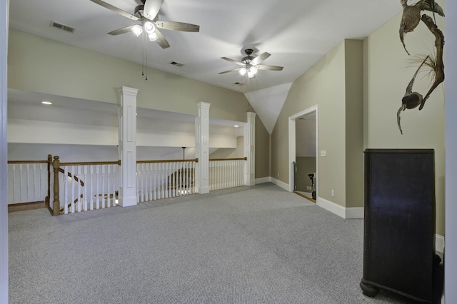additional living space featuring baseboards, carpet floors, visible vents, and a ceiling fan